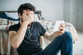 Portrait of a young man relaxing and watching a TV show on a tablet computer Royalty Free Stock Photo