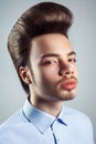 Portrait of young man with retro classic pompadour hairstyle.