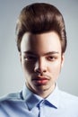 Portrait of young man with retro classic pompadour hairstyle. Royalty Free Stock Photo