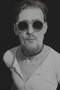 Portrait of young man in round sunglasses Royalty Free Stock Photo