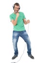 Portrait of a young man singing into microphone Royalty Free Stock Photo