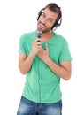 Portrait of a young man singing into microphone Royalty Free Stock Photo