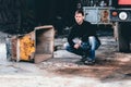 Portrait of young man sitting in in abandoned building Royalty Free Stock Photo