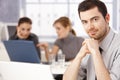 Portrait of young man sitting at meeting table Royalty Free Stock Photo