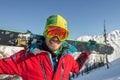 Portrait young man ski goggles holding ski in the mountains Royalty Free Stock Photo