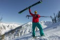 Portrait young man ski goggles holding ski in the mountains Royalty Free Stock Photo