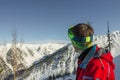 Portrait young man ski goggles looks to the mountains Royalty Free Stock Photo