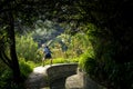 Portrait of young man standing on levada on Madeira island.