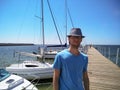 Portrait of a young man standing on the pier