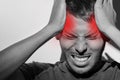 Portrait of young man suffering from painful migraine or strong tension headache Royalty Free Stock Photo