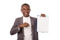 Portrait of young man in suit standing on white background Royalty Free Stock Photo