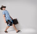 Portrait of young man in sunglasses with a suitcas Royalty Free Stock Photo