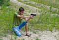Portrait of a young man taking aim with a pneumatic gun Royalty Free Stock Photo