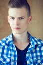 Portrait of a young man with very handsome face in blue casual s Royalty Free Stock Photo