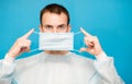 Portrait of young man wears protective mask and protective suit against air pollution or transmissible infectious diseases Royalty Free Stock Photo