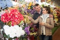 Couple choosing flowers at flower shop Royalty Free Stock Photo