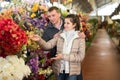 Couple choosing flowers at flower shop Royalty Free Stock Photo