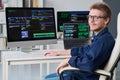 Portrait of Young Man Working with Computer Monitors in Office Royalty Free Stock Photo