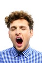 Portrait of a young man yawning Royalty Free Stock Photo