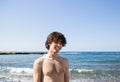 Portrait of a young man 18 -19 years old on the sea coast Royalty Free Stock Photo