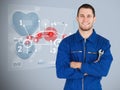 Portrait of a young mechanic next to futuristic interface