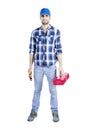 Young mechanic holding tool box and monkey wrench Royalty Free Stock Photo