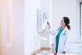 portrait of young medical doctor looking at an x-ray image in the office Royalty Free Stock Photo