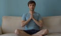 Portrait of young meditating man