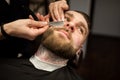 Young man having beard razor shaved Royalty Free Stock Photo