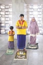 Young man prays with his son and wife in mosque Royalty Free Stock Photo