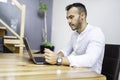 Portrait young mexican attractive businessman working at modern home office with computer laptop Royalty Free Stock Photo