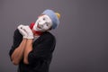 Portrait of young mime boy showing something with Royalty Free Stock Photo