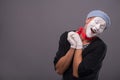 Portrait of young mime boy showing something with Royalty Free Stock Photo