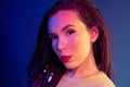 Portrait of a young mixed raced girl with braids against dark blue background Royalty Free Stock Photo