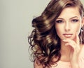 Portrait of young model with wavy, dense hair. Royalty Free Stock Photo