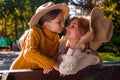 A Portrait Of Young Mother With A Small Daughter In Autumn Nature At Sunset. Royalty Free Stock Photo