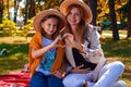 A Portrait Of Young Mother With A Small Daughter In Autumn Nature At Sunset. Royalty Free Stock Photo