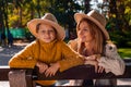 A Portrait Of Young Mother With A Small Daughter In Autumn Nature At Sunset. Royalty Free Stock Photo