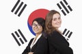 Portrait of young multiethnic businesswomen smiling over Korean flag Royalty Free Stock Photo