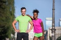 Portrait of young multietnic jogging couple ready to run