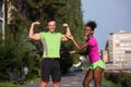 Portrait of young multietnic jogging couple ready to run