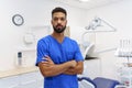 Portrait of young multiracial dentist at private dental clinic.