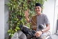 muslim male going to the mosque by riding motorbike