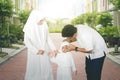 Young parents tidying veil of little daughter Royalty Free Stock Photo