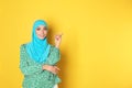 Portrait of young Muslim woman in hijab against color background. Royalty Free Stock Photo