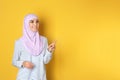 Portrait of young Muslim woman in hijab against color background Royalty Free Stock Photo