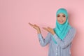 Portrait of young Muslim woman in hijab against color background Royalty Free Stock Photo