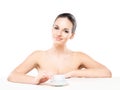 Portrait of a young and naked Caucasian woman with a cup of coffee
