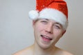 Portrait of young naked man with Santa hat Royalty Free Stock Photo