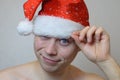 Portrait of young naked man with Santa hat Royalty Free Stock Photo